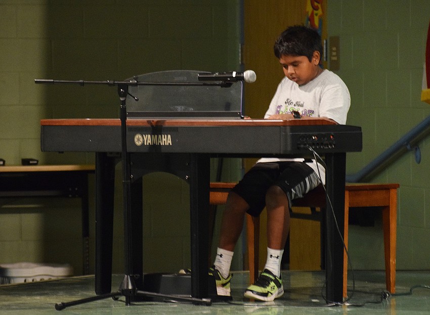 Fifth grader Sugan Fernando performs a keyboard solo.