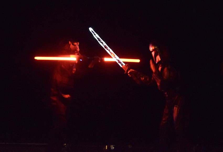 Fifth grader Jude Arbanis as Darth Maul fights against fifth grader Keagan Terry, who is playing the Mandalorian. The boys are big 