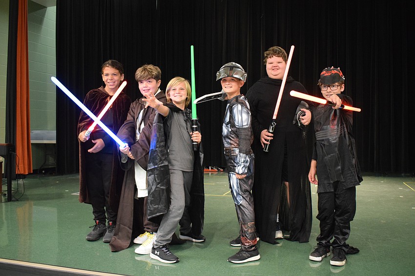 Fifth graders Jeffrey Davis, Lukas Nantes, Preston Fulmer. Keagen Terry, Gus Walsh and Jude Arbanis perform one of the most popular acts of the talent show. Students chanted 