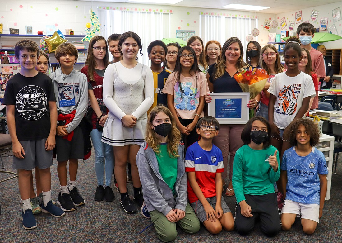 Gulf Gate Elementary teacher Michelle Rivas receives Barancik Foundationâ€™s Ripple Effect award in front of her class. (Courtesy image)