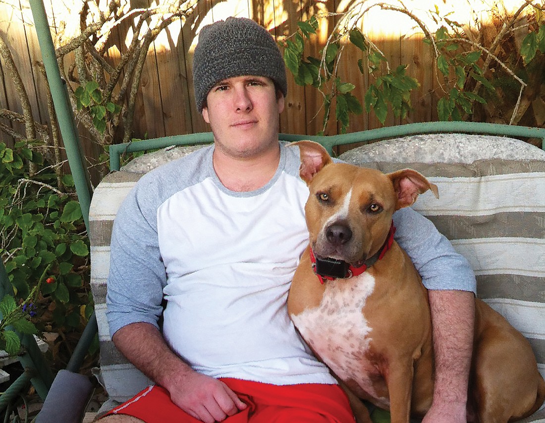 Forrest Schield with his dog, Penny, in March.