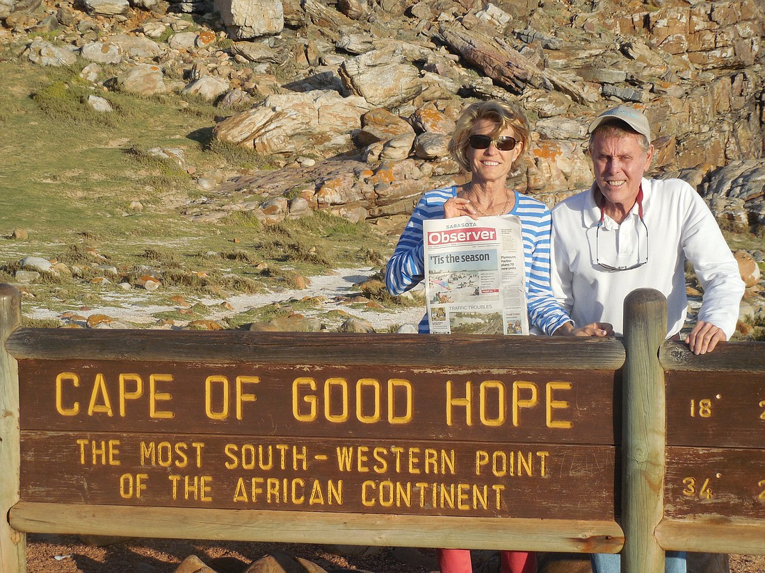Good news. Susan and William Kennedy catch up on their Sarasota Observer news at the Cape of Good Hope in South Africa.