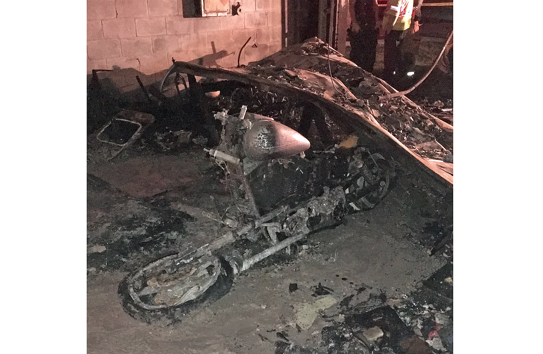 Firefighters believe the fire may have started with a motorcycle in the garage. (Photo courtesy of the city of Palm Coast.)