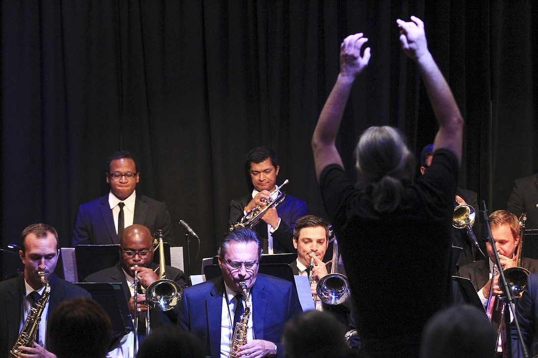 Blue Bamboo Vice President and Creative Director Mark Piszczek, right, conducted a musical piece he wrote, which was performed by the Orlando Jazz Orchestra.