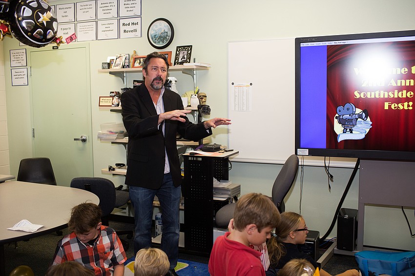 Teacher John Freeman introduces the students' project.