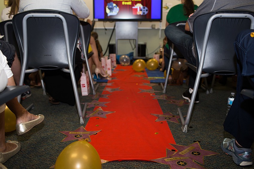 The classroom was decorated with a red carpet, balloons and hollywood stars.