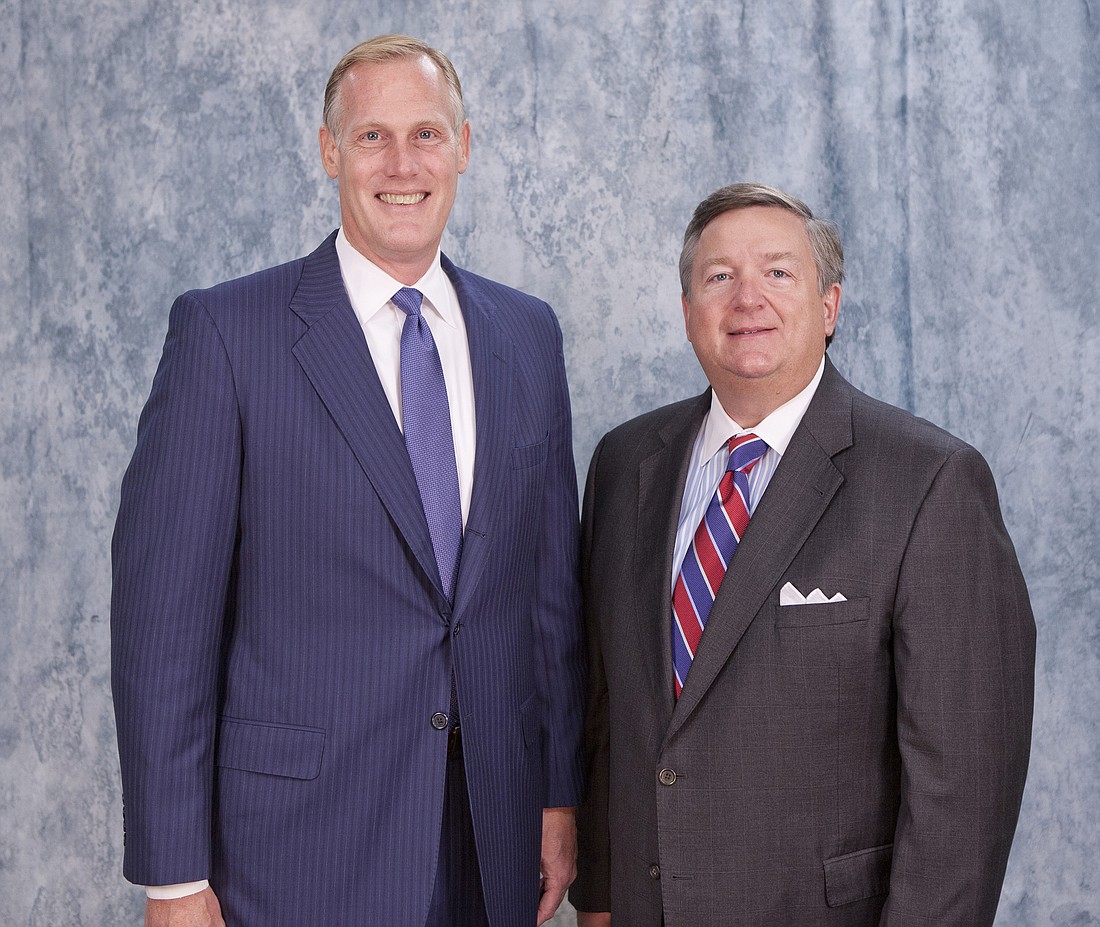 Chip Reeves (left) and Carl Chaney are leading the rebuilding of Beach Community Bank. Courtesy Blacksuit FM Photography