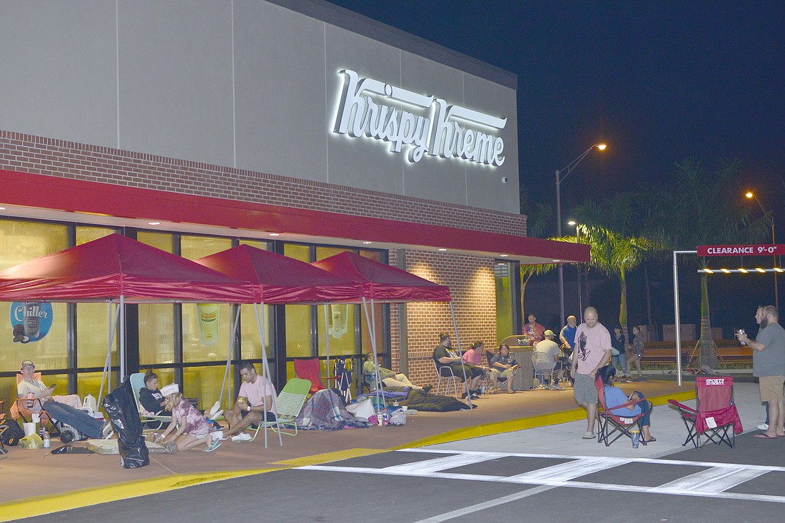 About 450 doughnut-cravers camped out overnight to be first in line for the Krispy Kreme Fort Myers grand opening last fall. By the time the doors opened a crowd of about 650 had was waiting. Courtesy Spiro & Associates