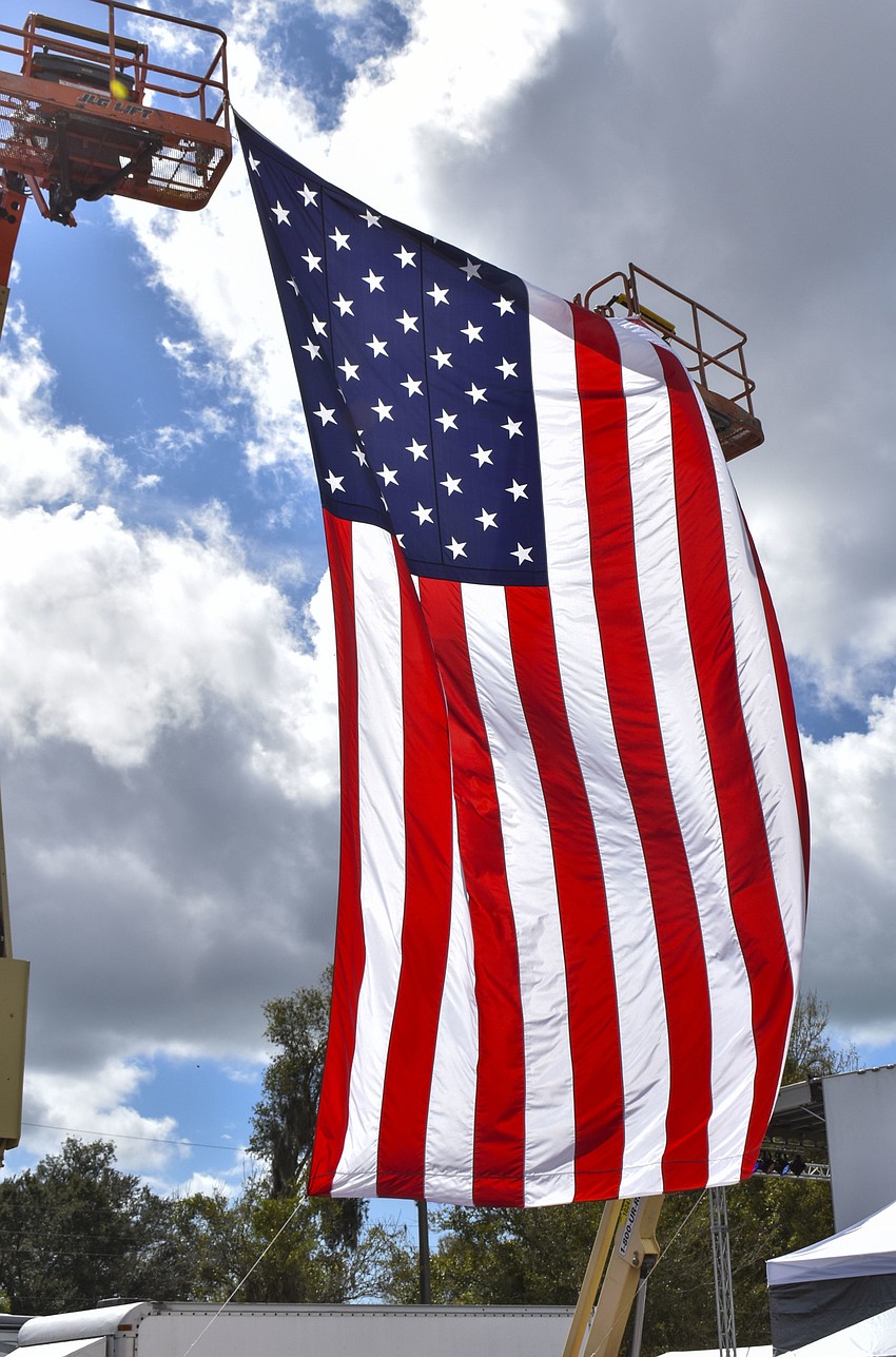 The American flag waves above the festival.