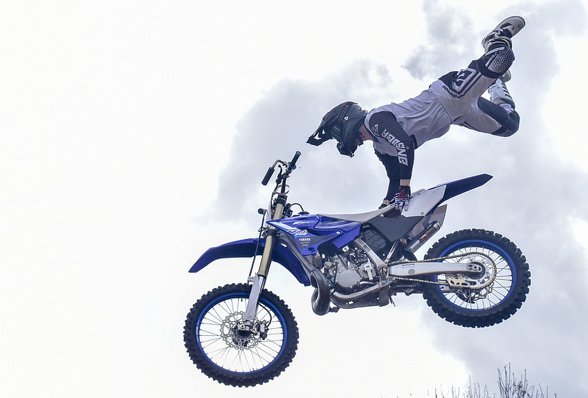 One of the FMX freestylers pulls a trick.