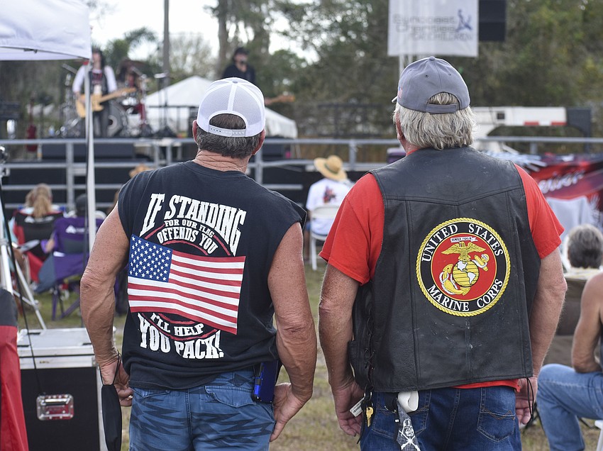 Benton Byrd and Peter Fredenburg watch and listen to the live music.