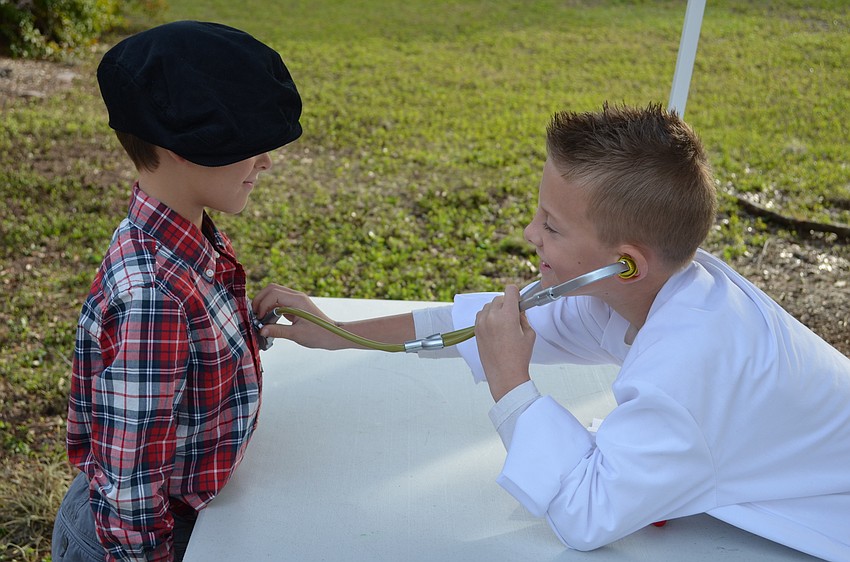 Connor Sankes fills out his information in his passport.