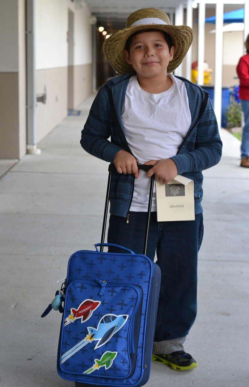 Lila Robertson with her luggage dressed as an immigrant from England.