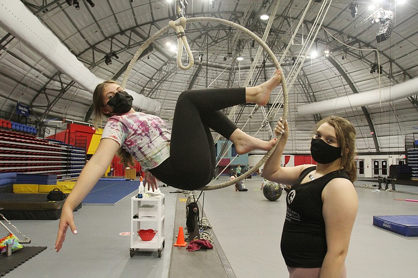 MARCH: Jules Morgan performers acts with the lyra with counselor Emma Wilson Weber.