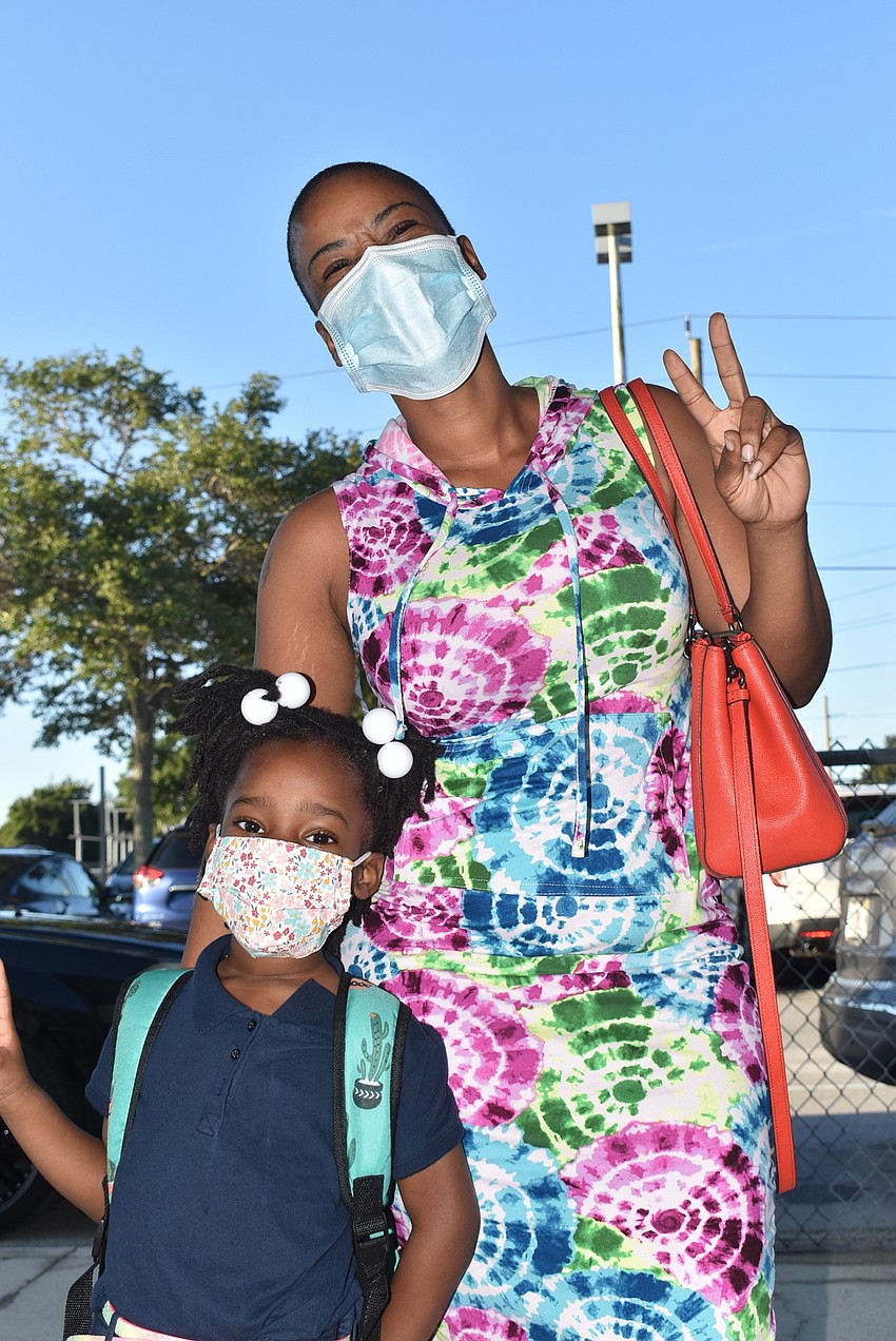 AUGUST: Dotrice McCollough takes her daughter Ava to her first day of kindergarten at Emma E. Booker Elementary School.