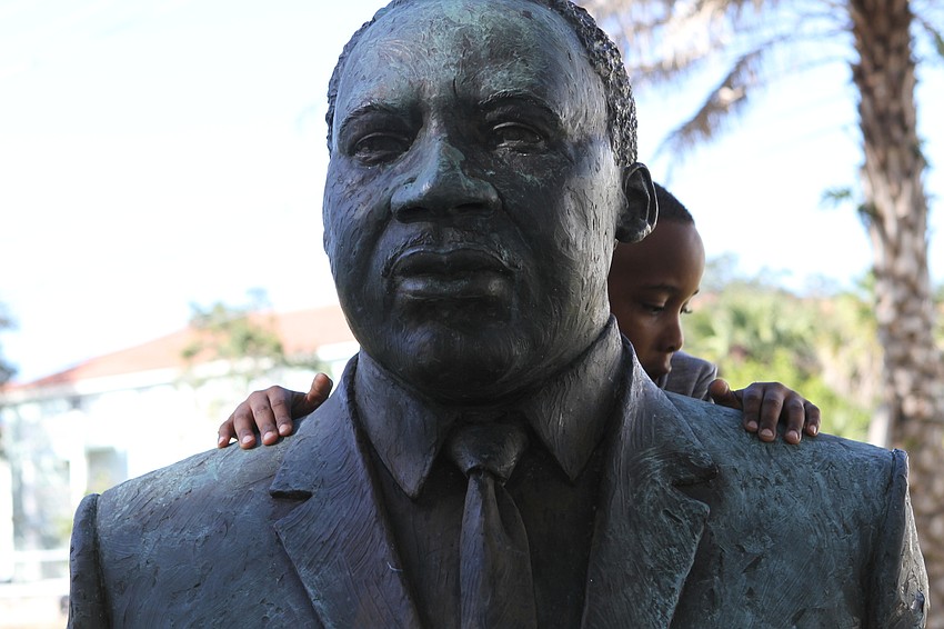 JANUARY: Takiyan Coleman, 7, climbed the Martin Luther King, Jr. bust during the event.