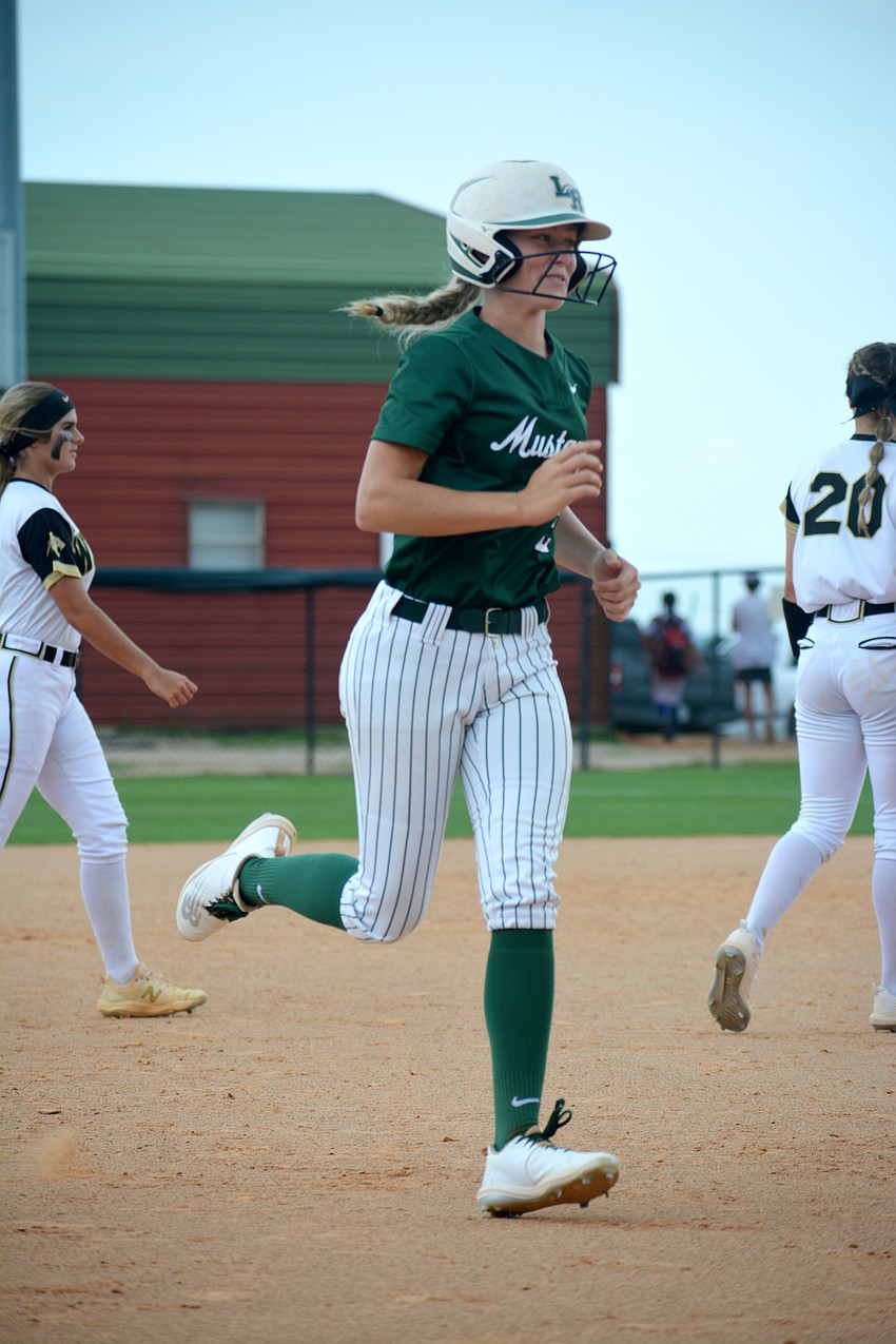 Lakewood Ranch junior Addyson Bruneman rounds third base after hitting a solo home run against Western High.