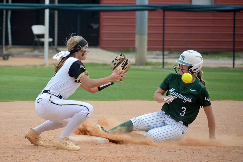 Lakewood Ranch junior Cassidy McLellan slides into second base before the ball reaches Western's Melanie Carr.