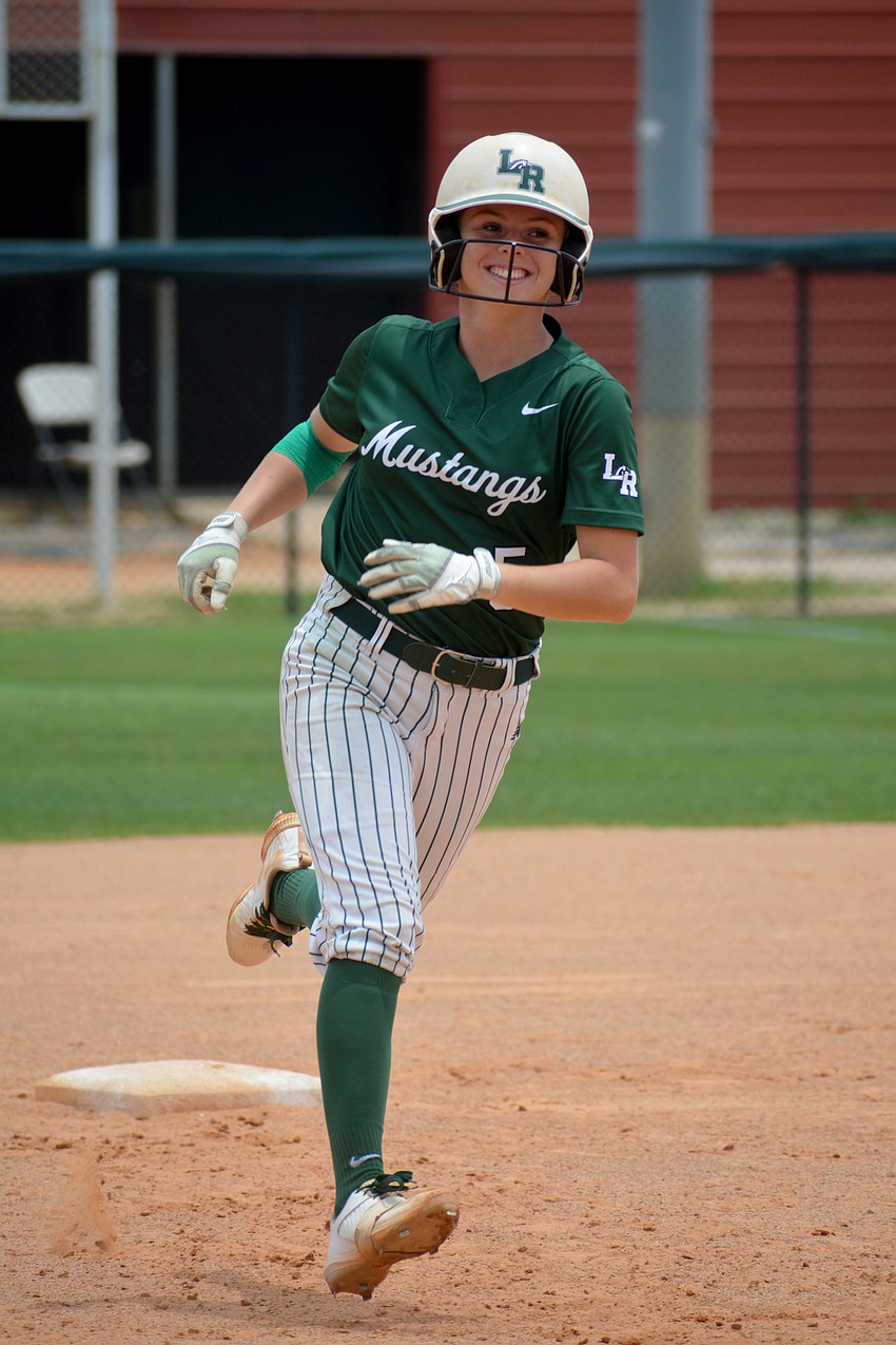 Lakewood Ranch senior Ella Coiner smiles after hitting a grand slam — her first ever grand slam — in the Mustangs' 11-3 win over Western High.