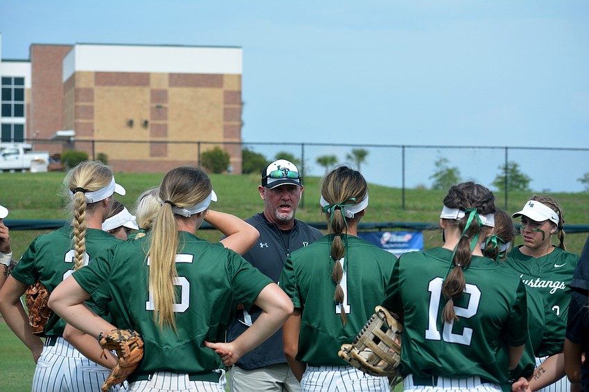 T.J. Goelz talks to his team following a rain and lightning delay.