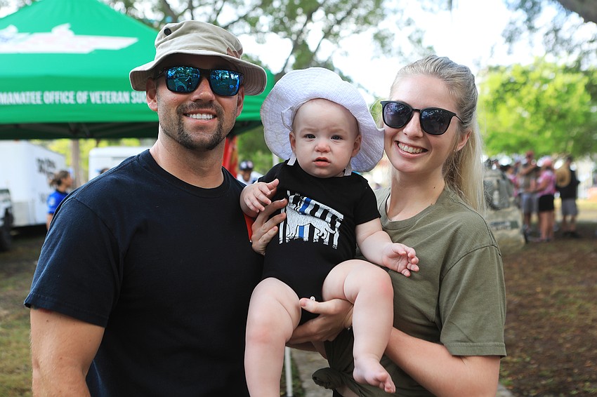 Adam Arena and Jasmine Eastman hold Lily Arena