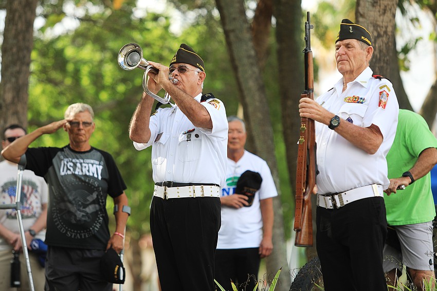Members of VFW 3233 play TAPS.