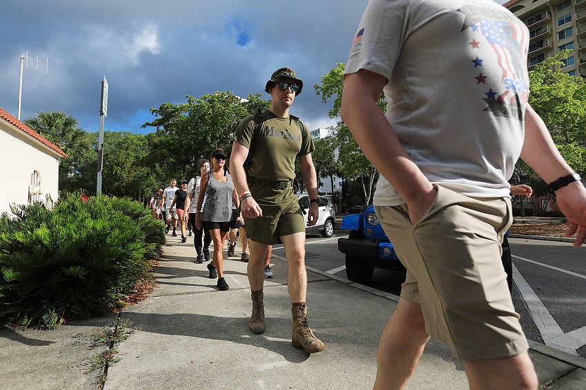 Veterans and civilians alike march through downtown Sarasota.
