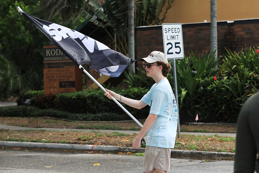 Preston Kehs waves the crowd on.