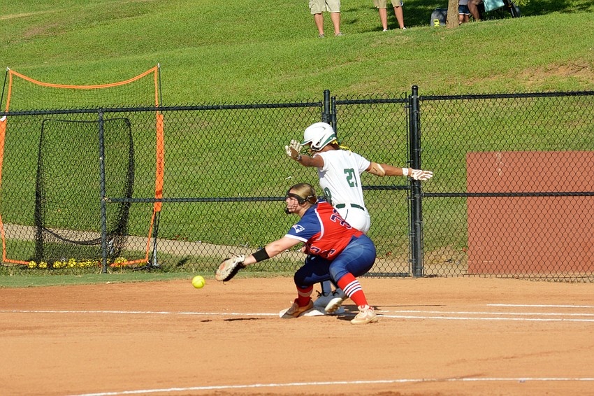Lakewood Ranch High senior Sydney McCray beats a throw to first base against Lake Brantley High.