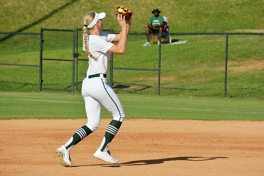 Lakewood Ranch High junior Addyson Bruneman catches a pop-up and turns to throw to first base against Lake Brantley High.