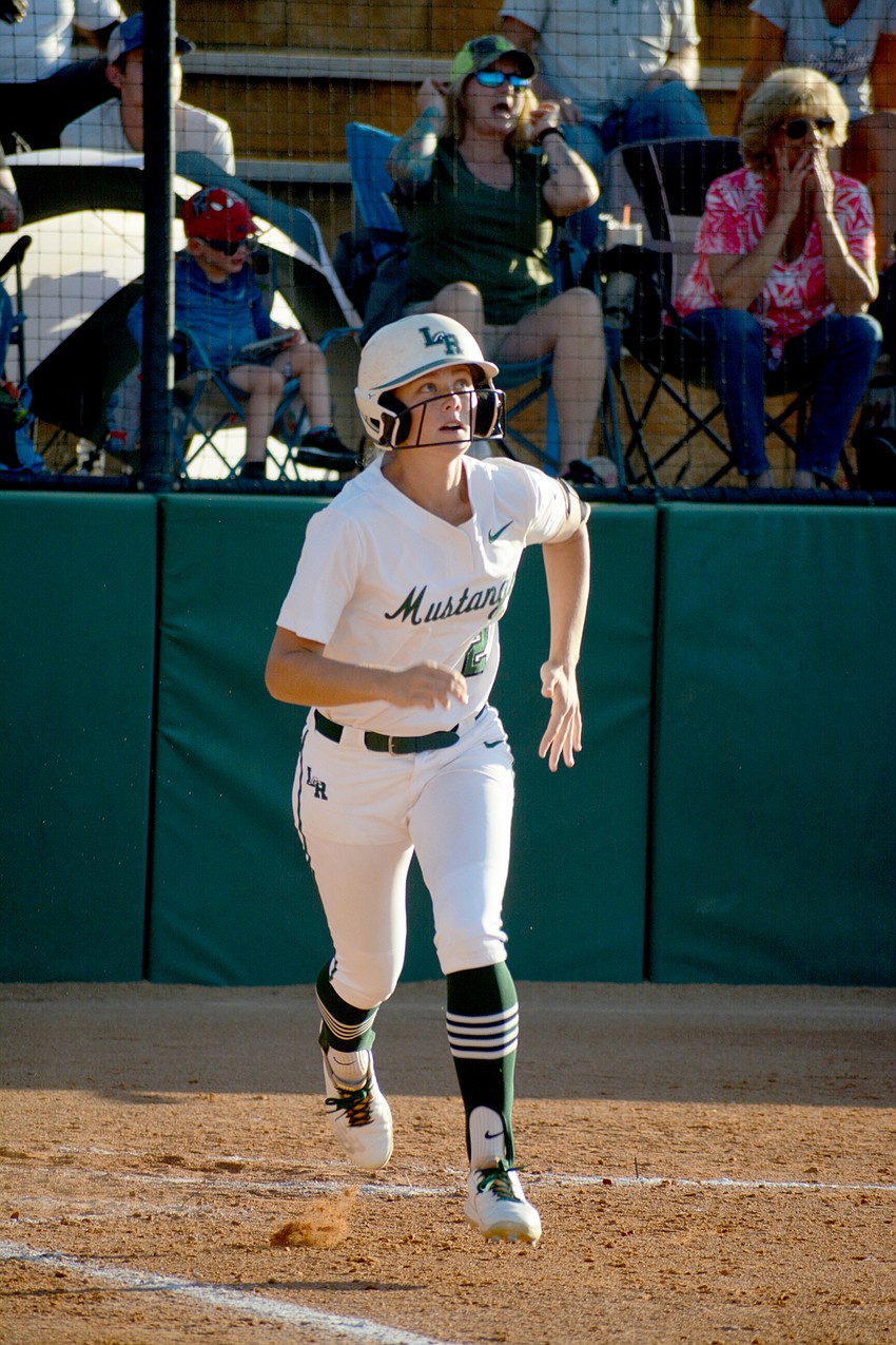 Lakewood Ranch High junior Addyson Bruneman watches her ball land for a triple against Lake Brantley High.