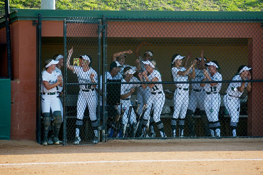 The Lakewood Ranch High dugout explodes during the team's five-run fourth inning against Lake Brantley High.