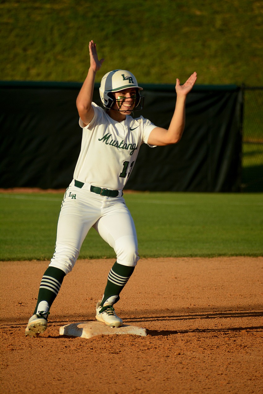 Lakewood Ranch High senior Taylor Shepherd claps after hitting an RBI double against Lake Brantley High.
