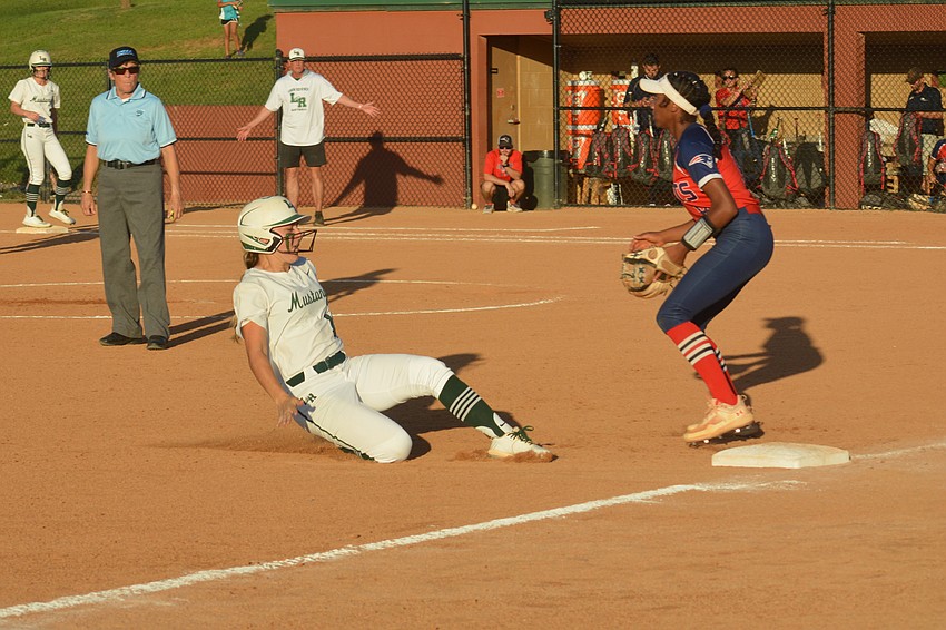 Lakewood Ranch High senior Taylor Shepherd slides safely into third base against Lake Brantley High.
