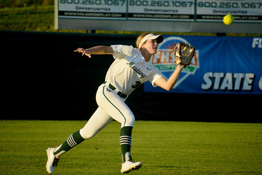 Lakewood Ranch High junior Cassidy McLellan catches a fly ball in center field against Lake Brantley High.