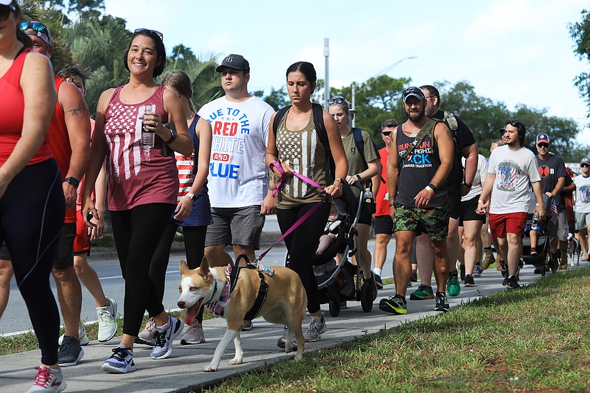 Jalyne Supply walks Chloe the dog.