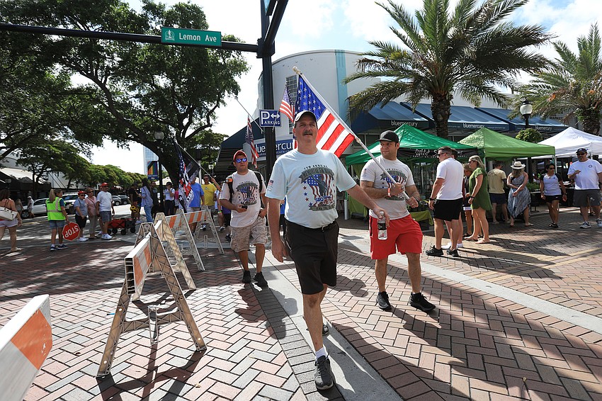 Mayor Erik Arroyo, SRQ Vets co-founder SRQ Vets co-founder Bill Sterbinsky and others lead the march.