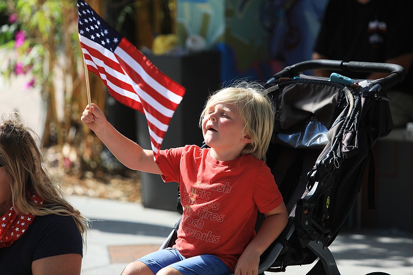 Rynland Boggs waves his flag proudly.