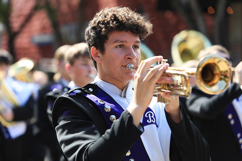 Members of the Blair High School marching band from Nebraska play their instruments.