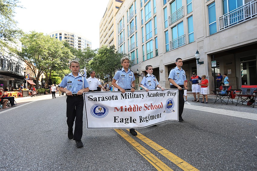 Cody Traska, Arthur Seegerer, Colin Barrett and Nicholas Penrod lead the Sarasota Military Academy Prep segment of the parade.