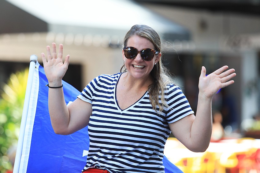 State Rep. Fiona McFarland waves to the crowd.