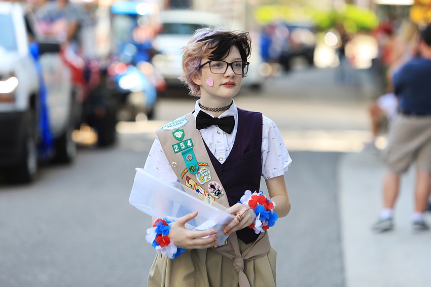Girl Scouts of Gulfcoast Florida member Penelope Johnson walks along the side of the parade.