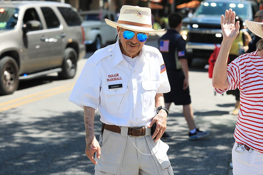 Parade Marshall Dan Kennedy walks at the end of the parade.