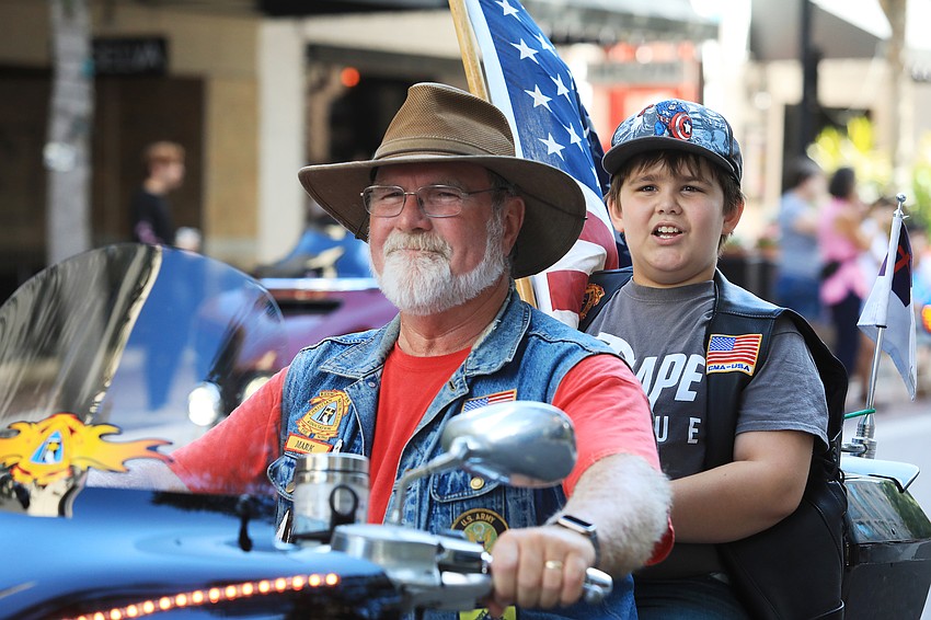 Mark Shelby and Mark Shelby Jr. ride along together.