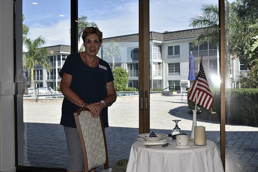 Karen Pasnkow set a fallen soldier's table.