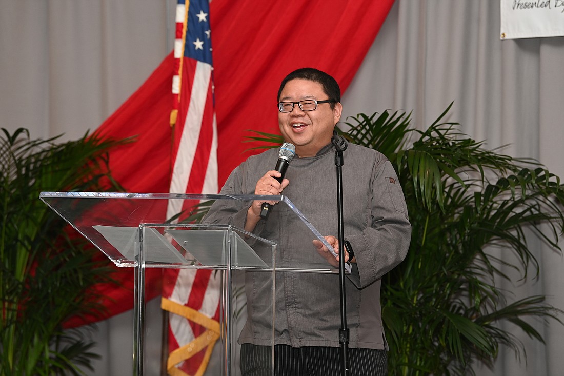 Blue Bamboo Canton Bistro & Bar owner and chef Dennis Chan speaks while accepting his Small Business Person of the Year Award. (Florida SBDC)