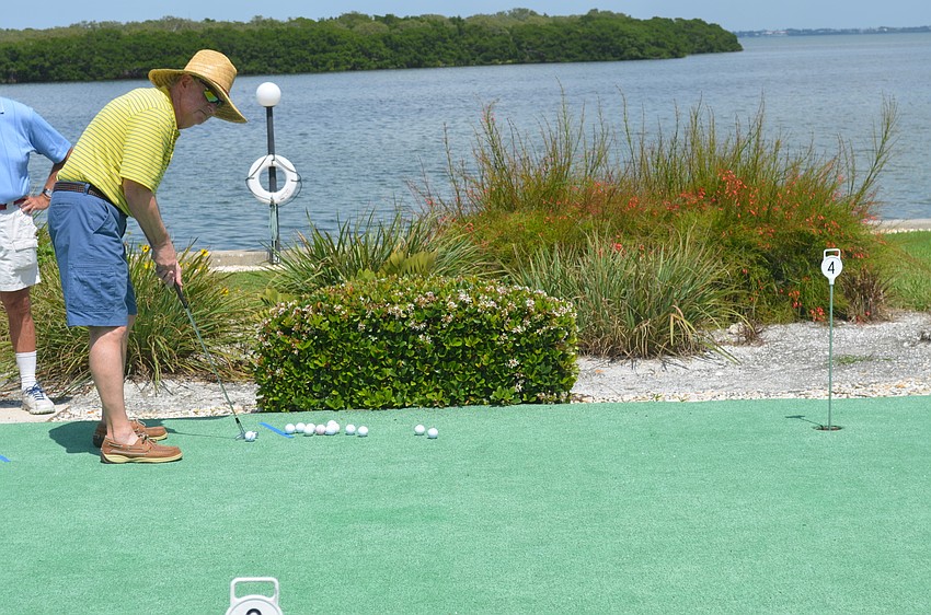 Ken Simpson participates in the putt-putt tournament.