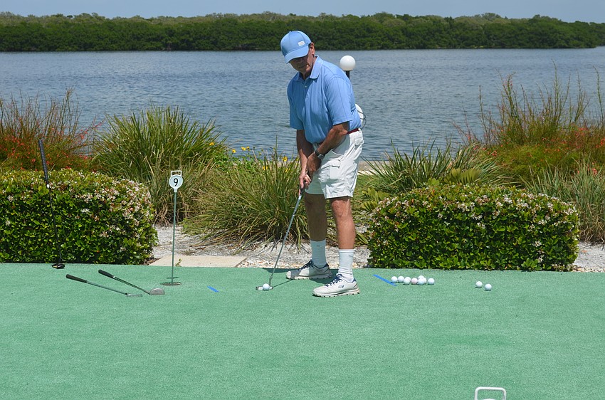 Steve Kasden participates in the putt-putt tournament.