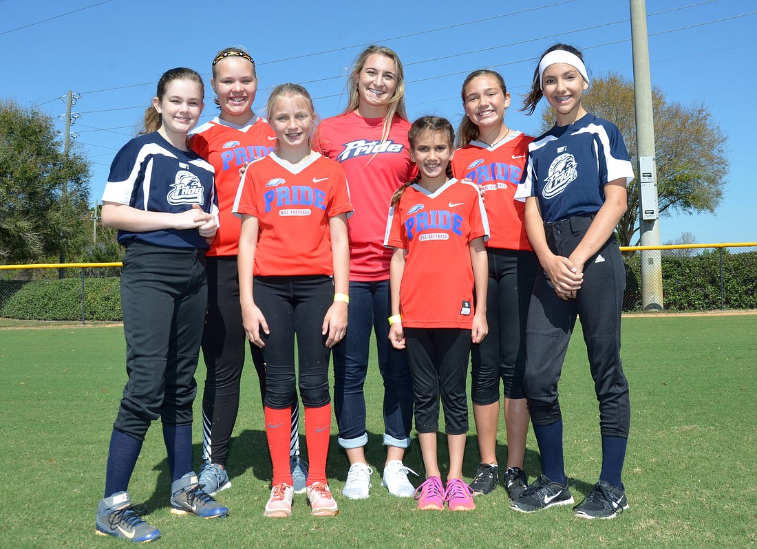 Softball players at local Little Leagues don pro league's team names,  jerseys