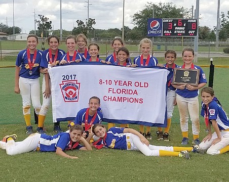 Softball players at local Little Leagues don pro league's team names,  jerseys